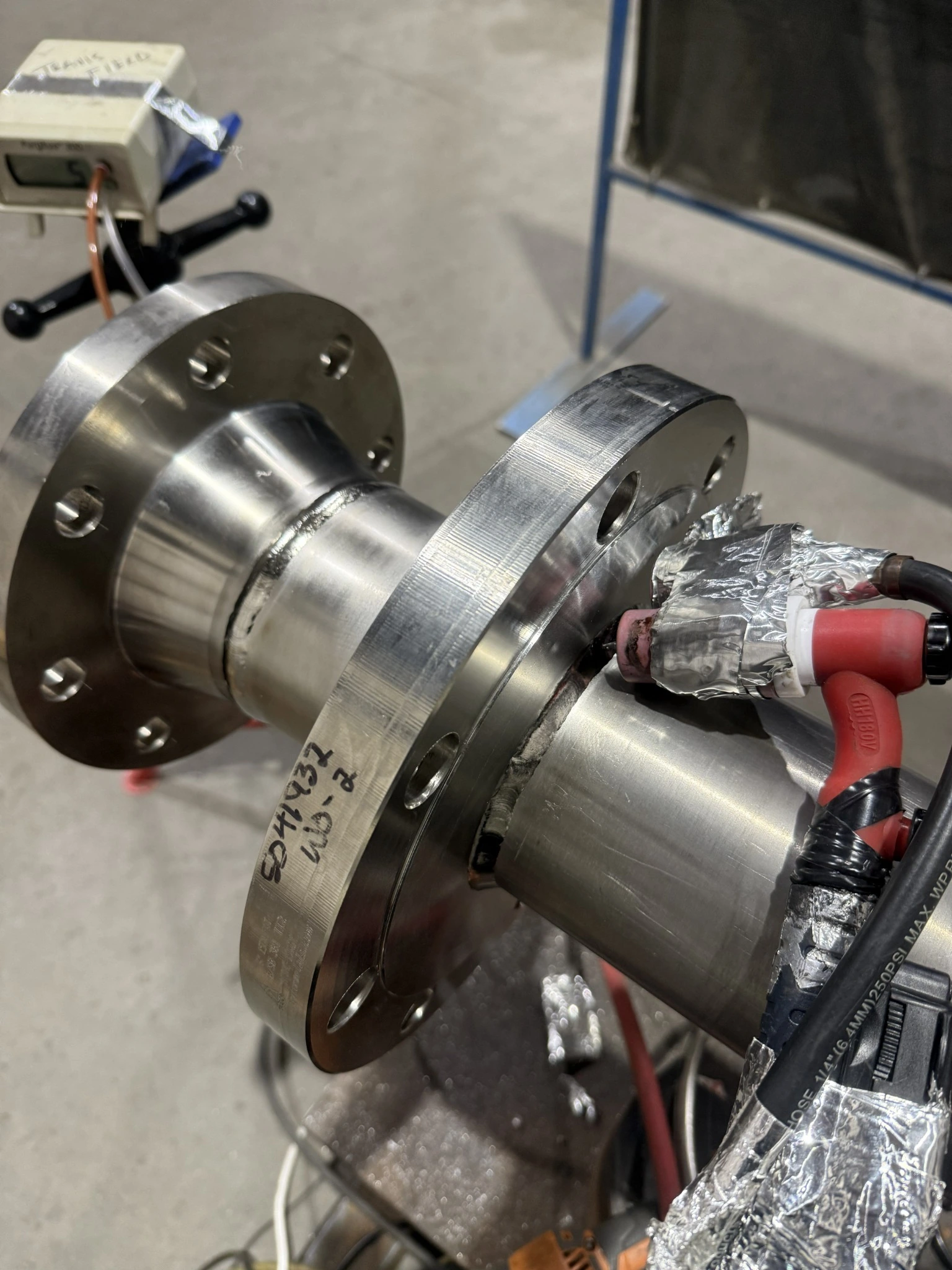 Titanium flanged spools with TIG torch and shielding setup